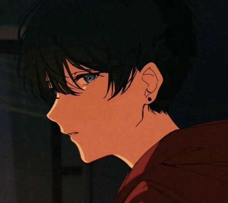 Chàng trai anime buồn ngồi lặng trong góc tối